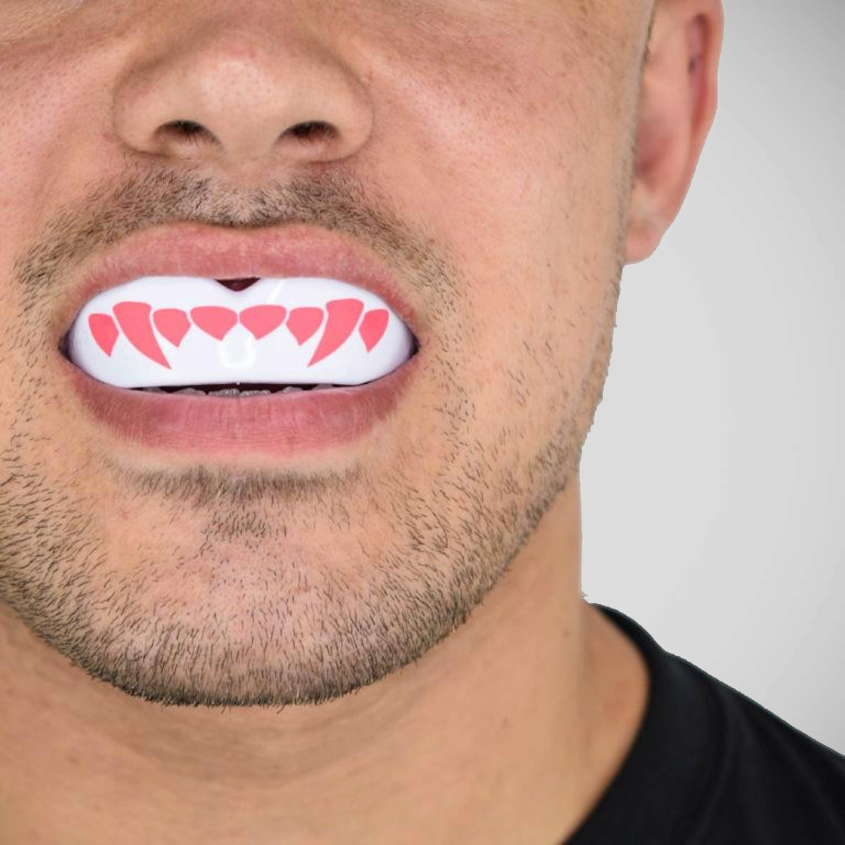 White/Pink SafeJawz Extro Pink Fangz Mouth Guard